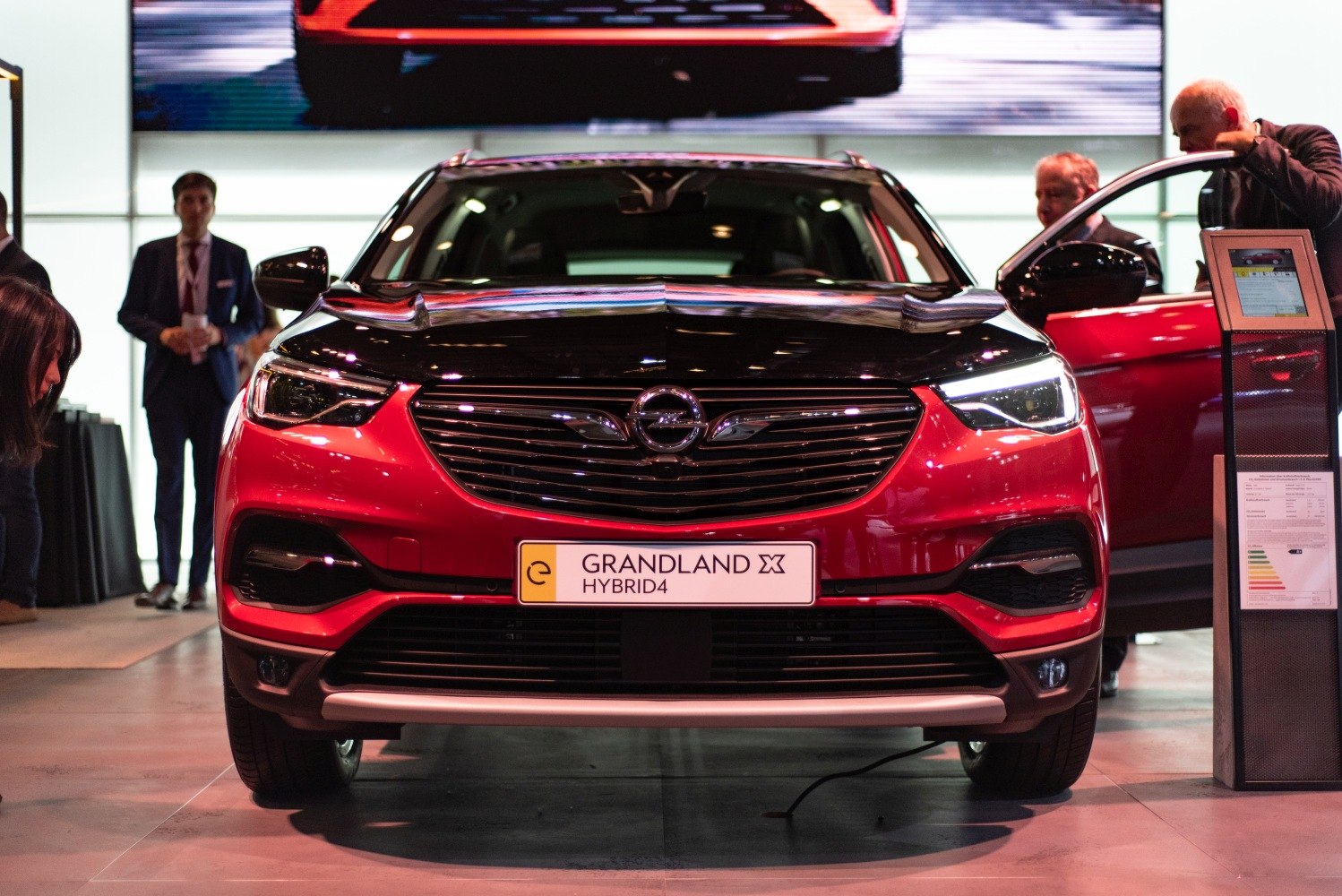 Front view of a hybrid SUV with distinctive grille and LED headlights