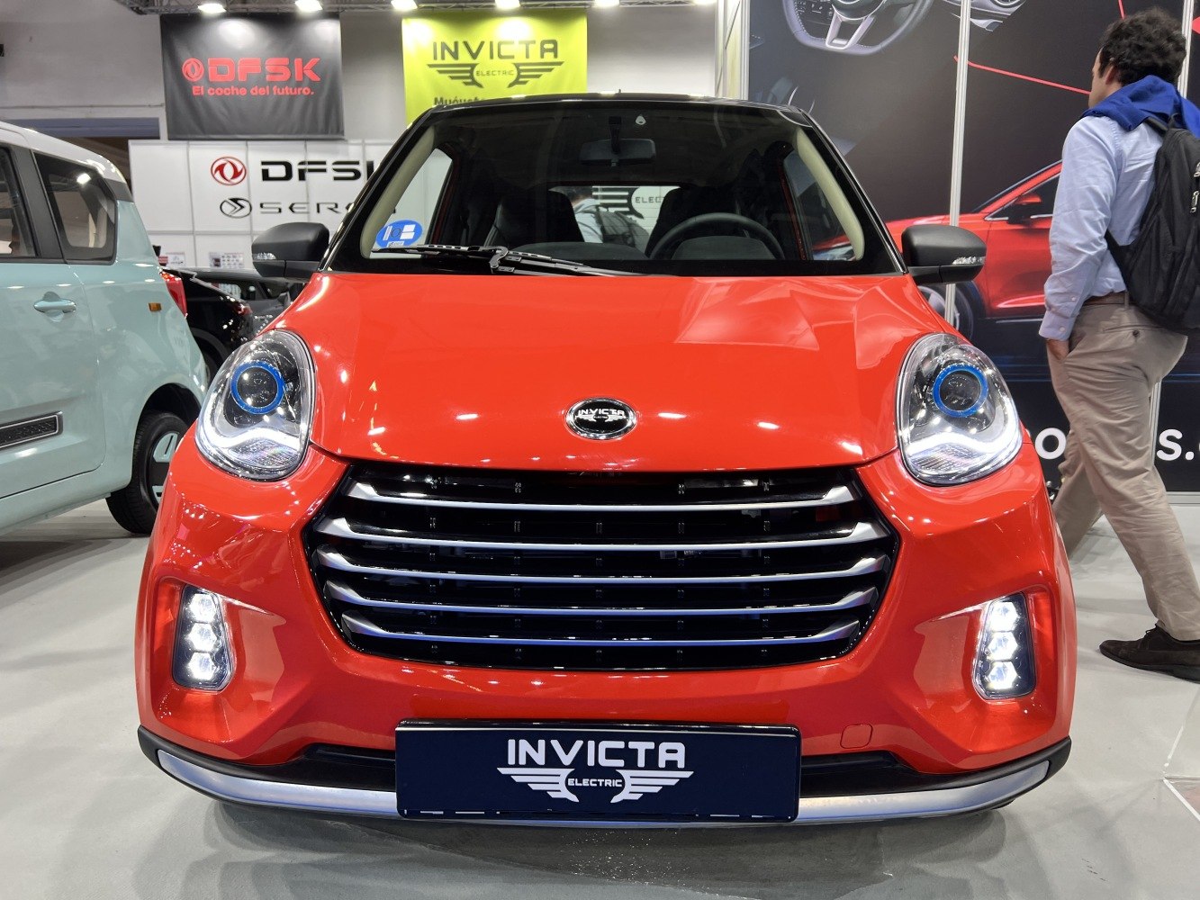 Front grille and LED headlights of a compact electric vehicle.