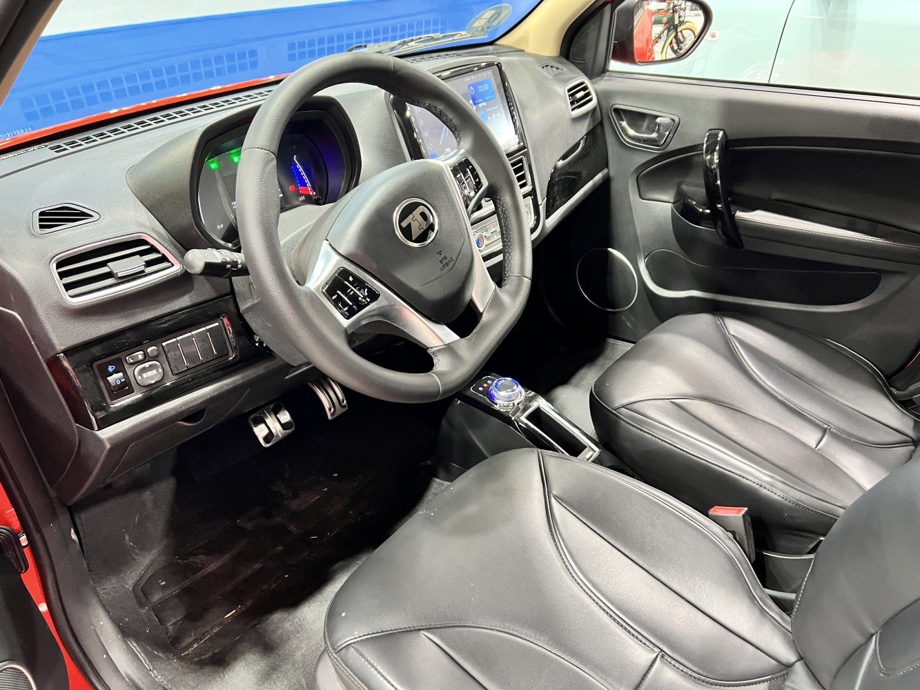 Modern dashboard and steering wheel with controls in car interior