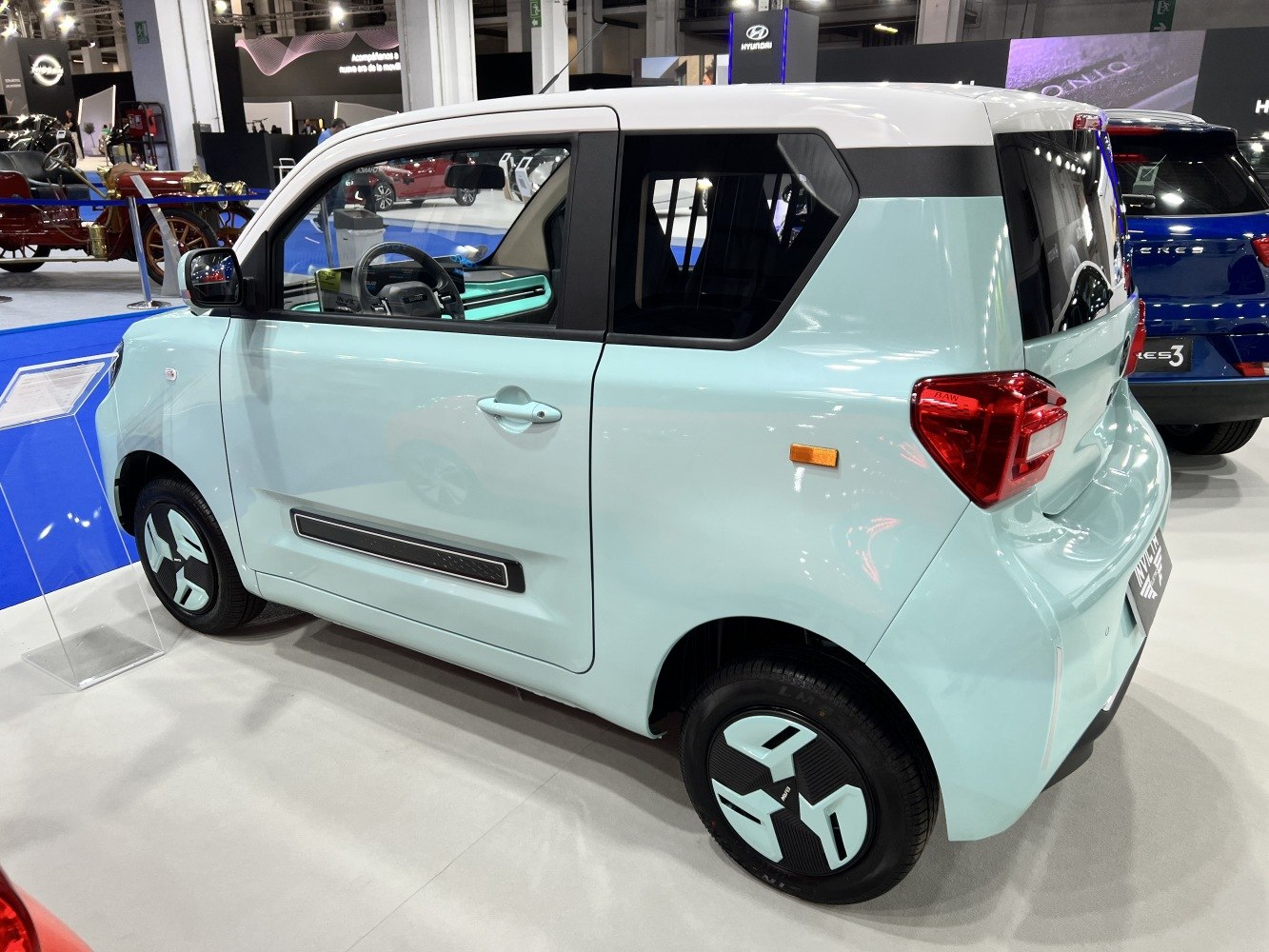 Compact electric car with angular rear and modern wheel covers