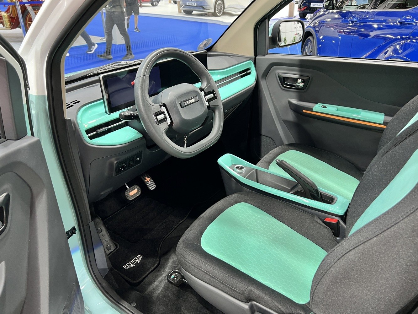 Turquoise-accented modern dashboard and seats interior