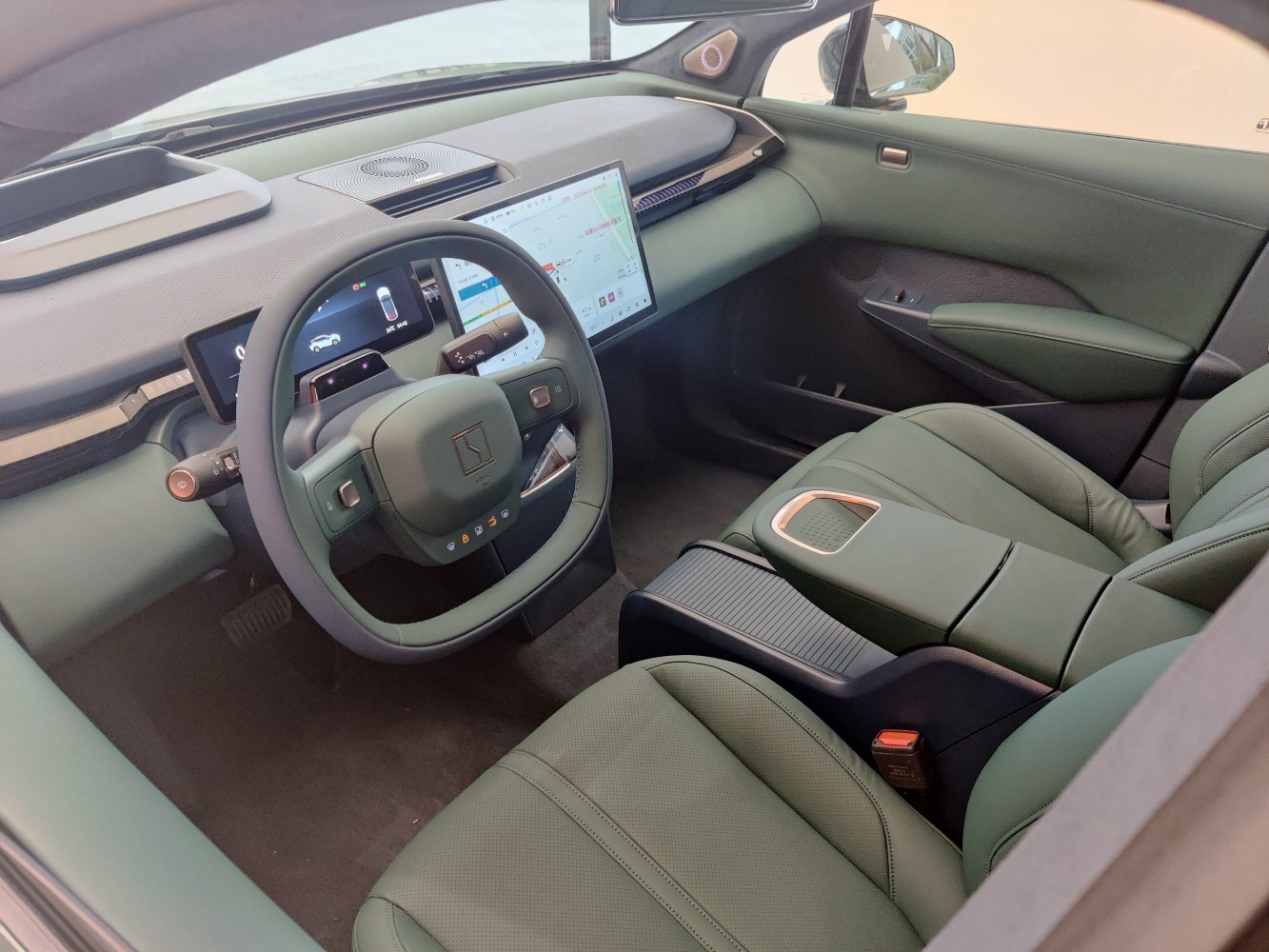 Modern digital dashboard and unique steering wheel design