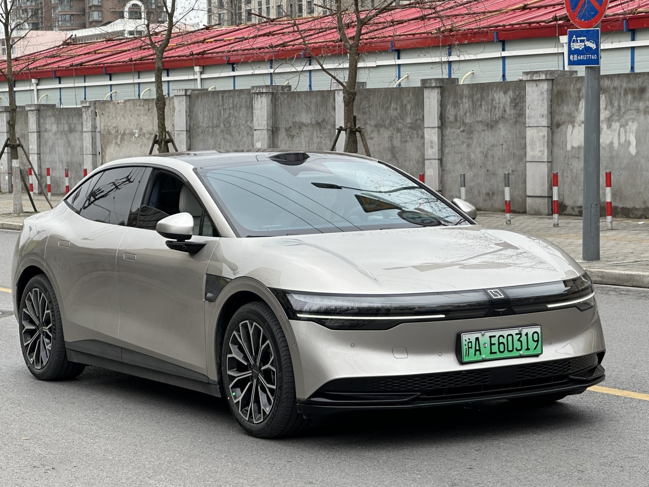 Electric sedan with LED headlights and panoramic sunroof