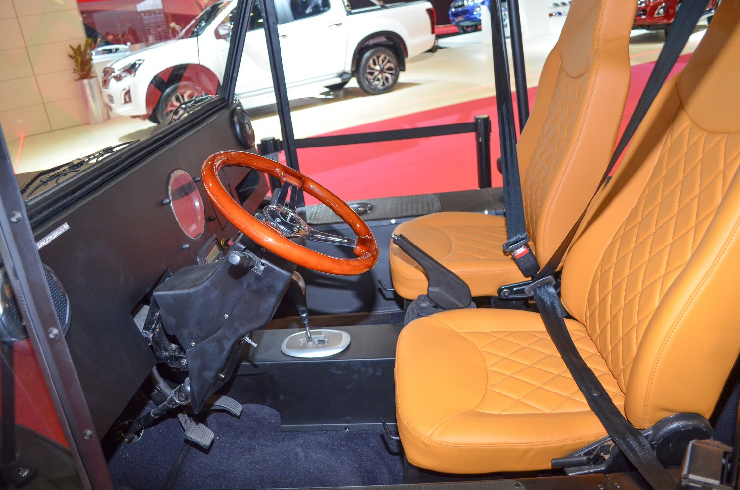 Wooden steering wheel and premium diamond-stitched tan seats interior