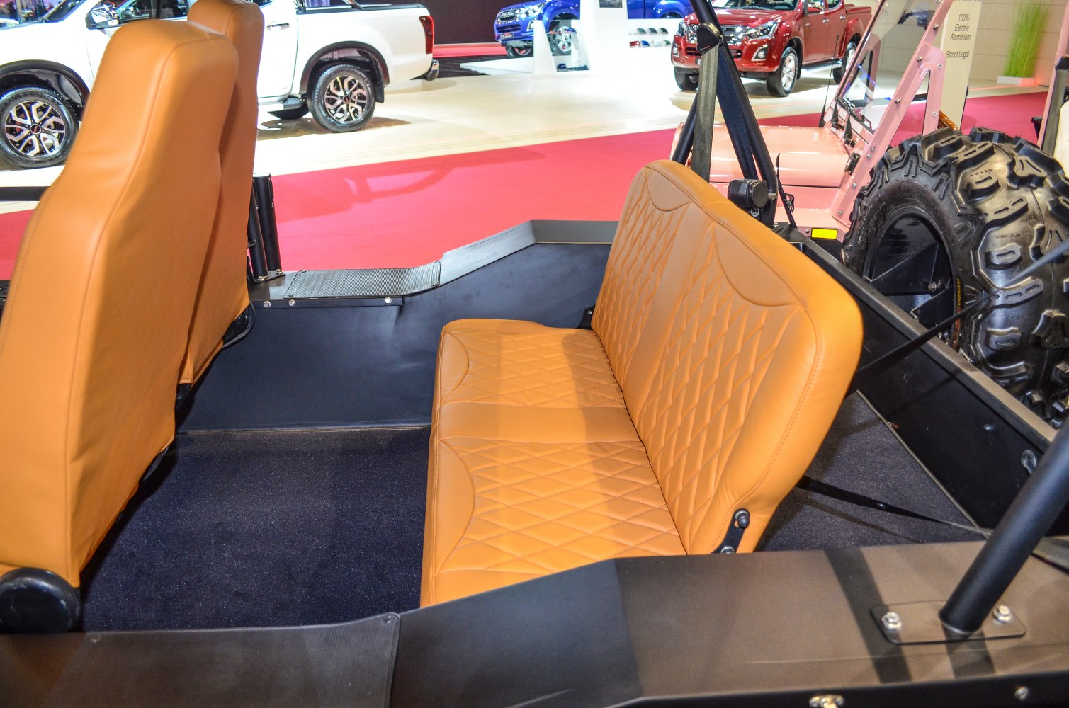 Diamond-stitched tan leather rear bench and front seat backs