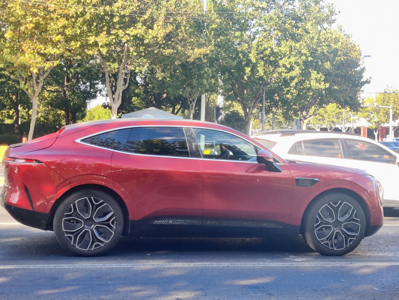 Sleek electric SUV side profile with modern alloy wheels