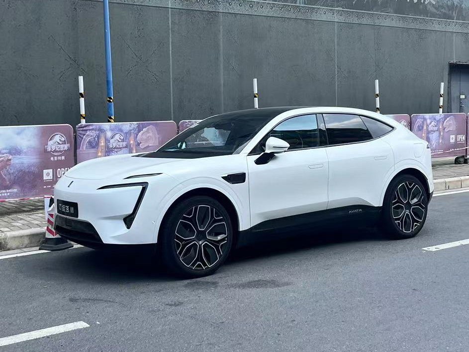 White modern SUV with angular LED headlights and designer alloy wheels