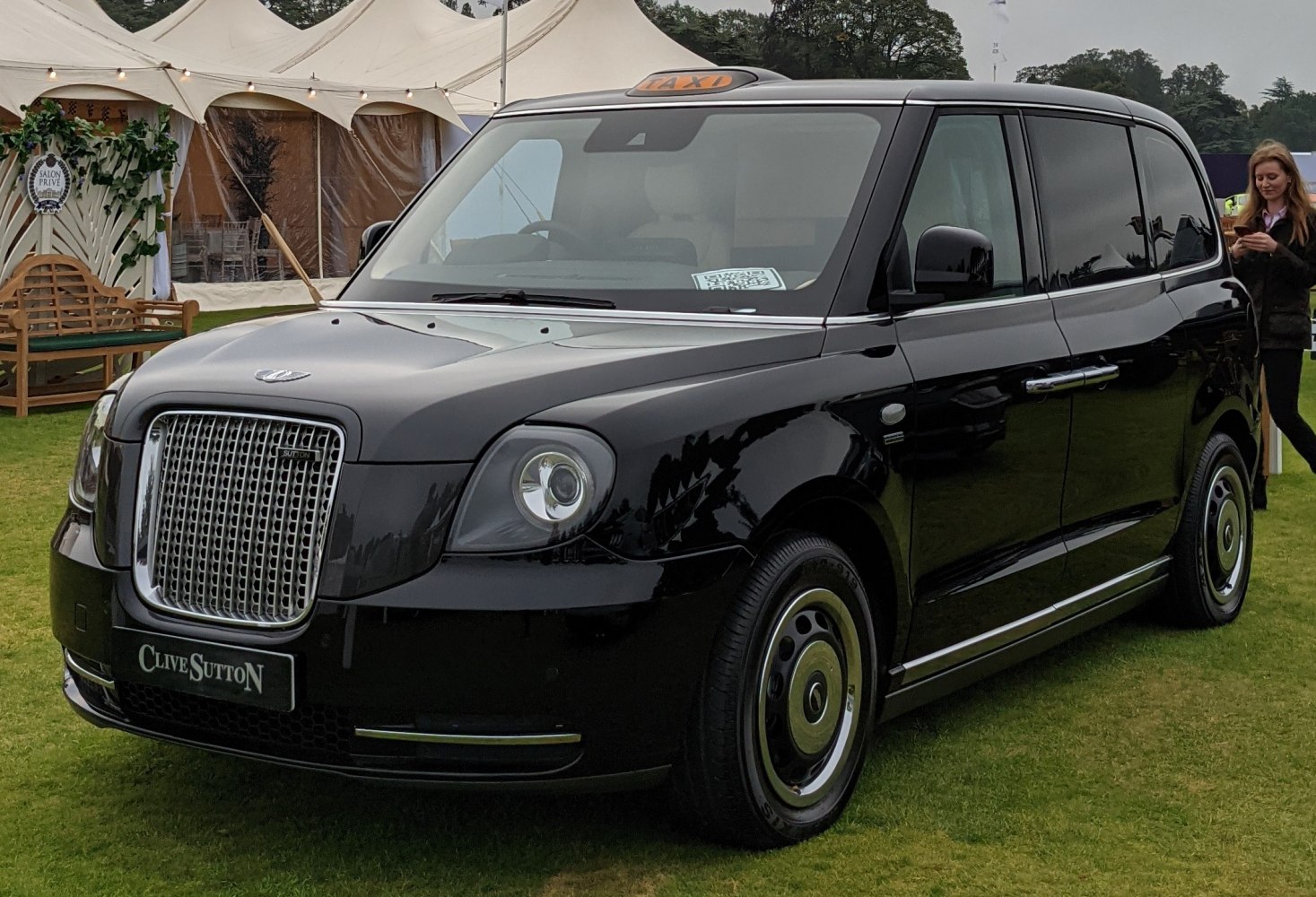 Modern taxi with iconic grille and rooftop taxi sign