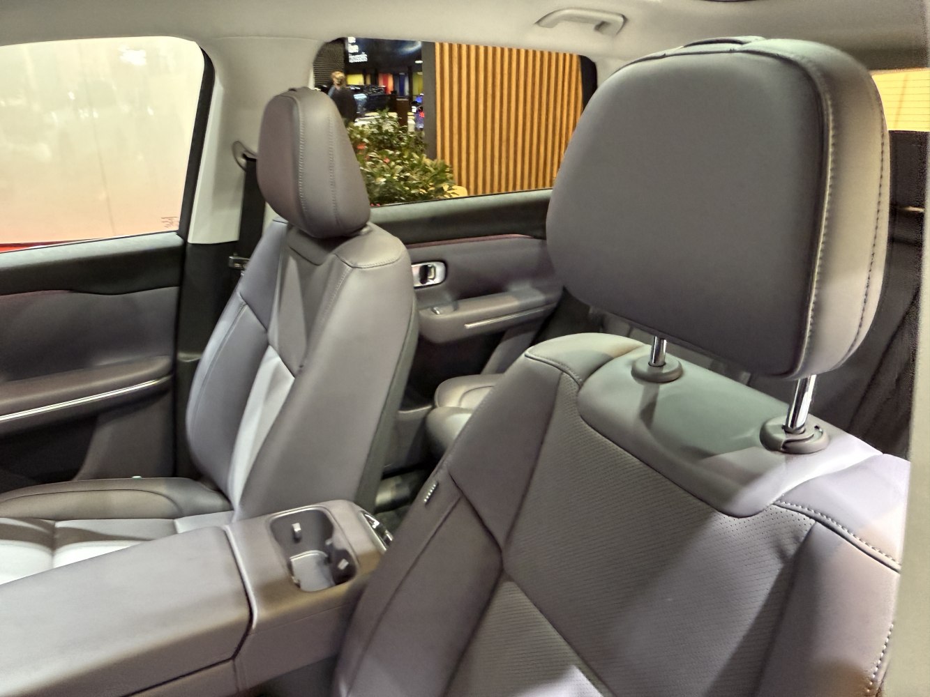 Close-up of modern front and rear leather seats with armrest