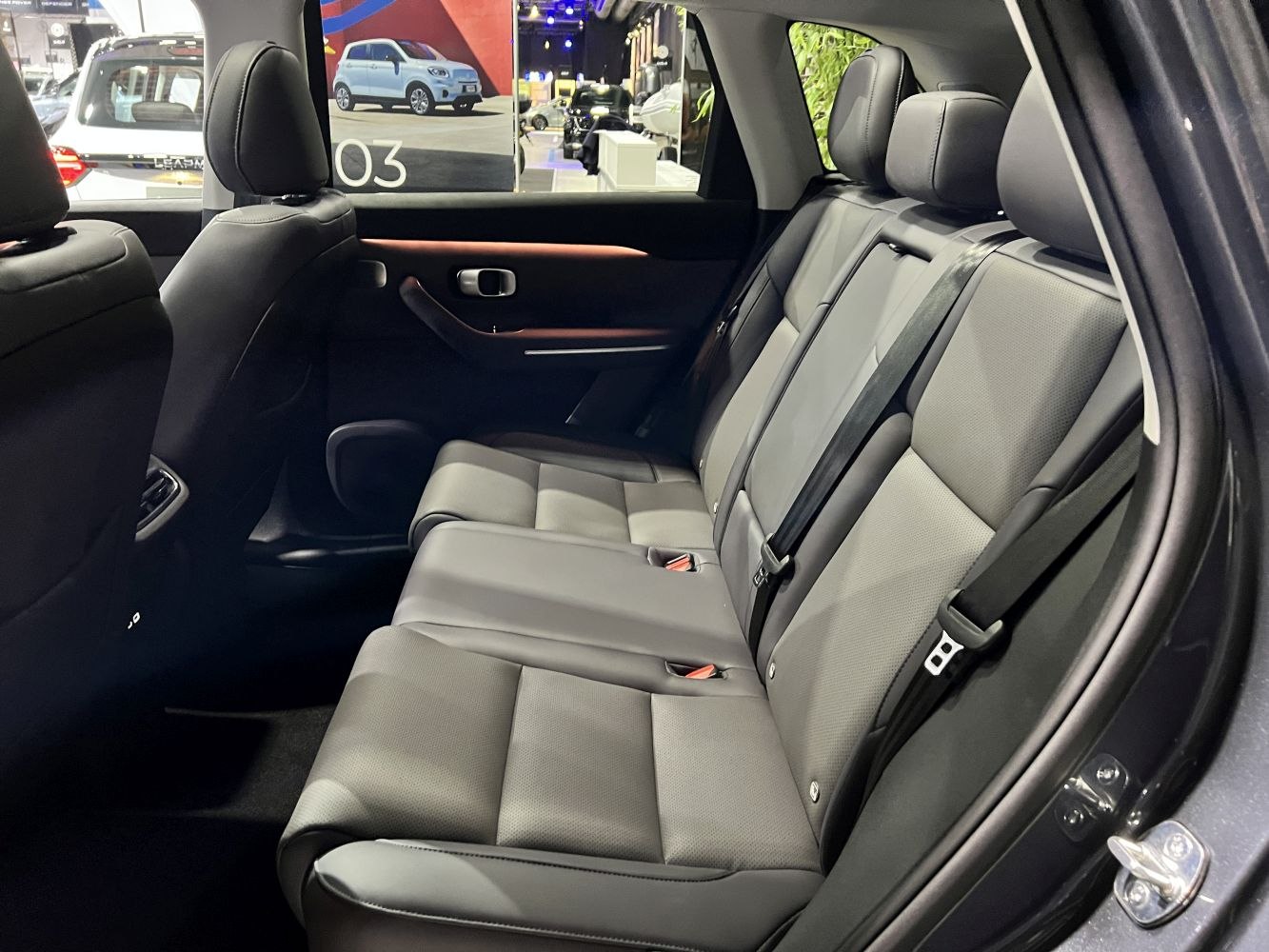 Modern rear seat interior with leather upholstery and seat belts
