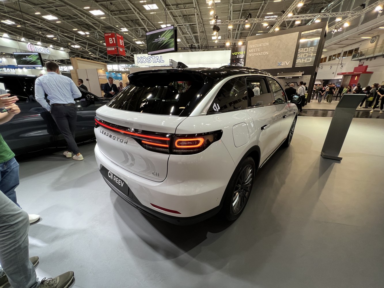 Sleek rear design with continuous LED light bar and black roof contrast.