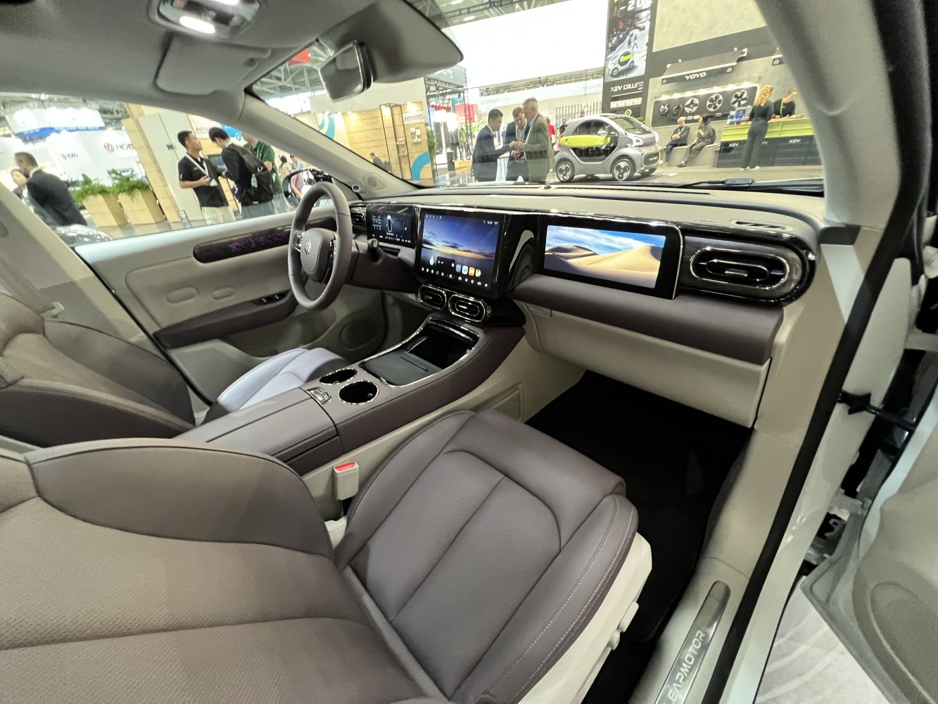 Dual digital dashboard screens and premium driver and passenger seating.