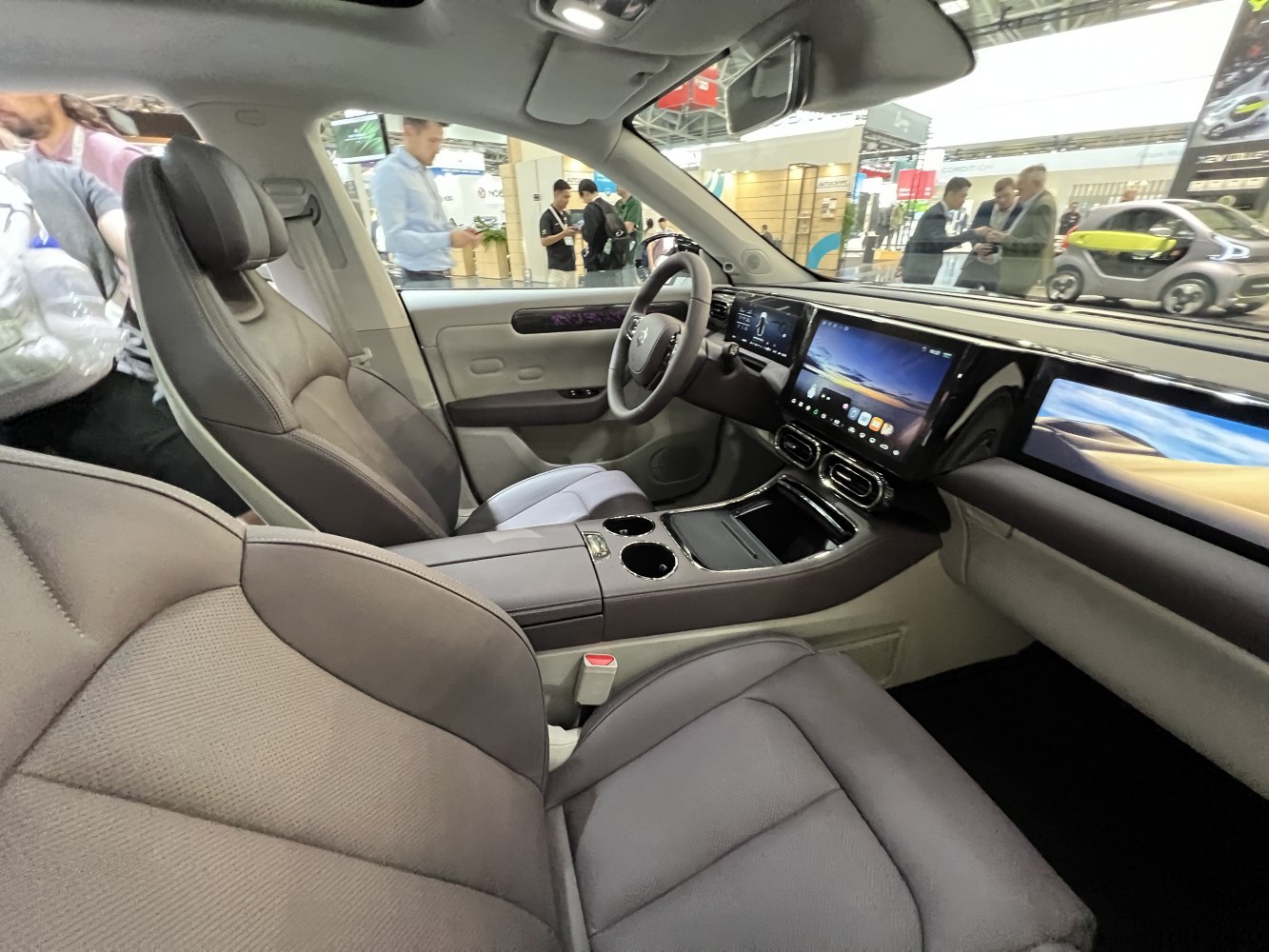 Spacious modern interior with dual widescreen displays and premium seats.