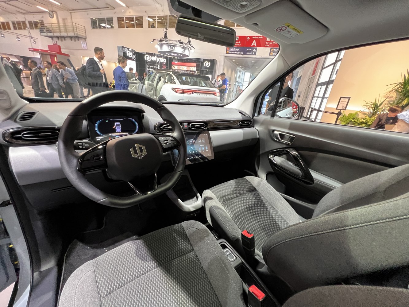 Digital instrument cluster and central touchscreen in car interior