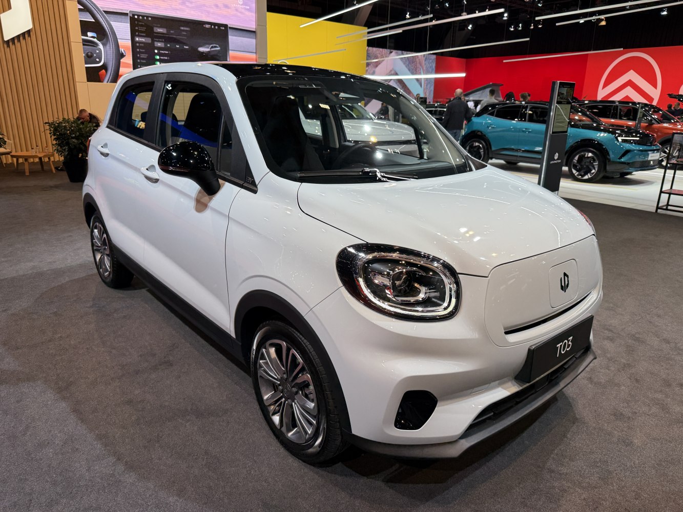 Front view of compact electric hatchback with LED headlights