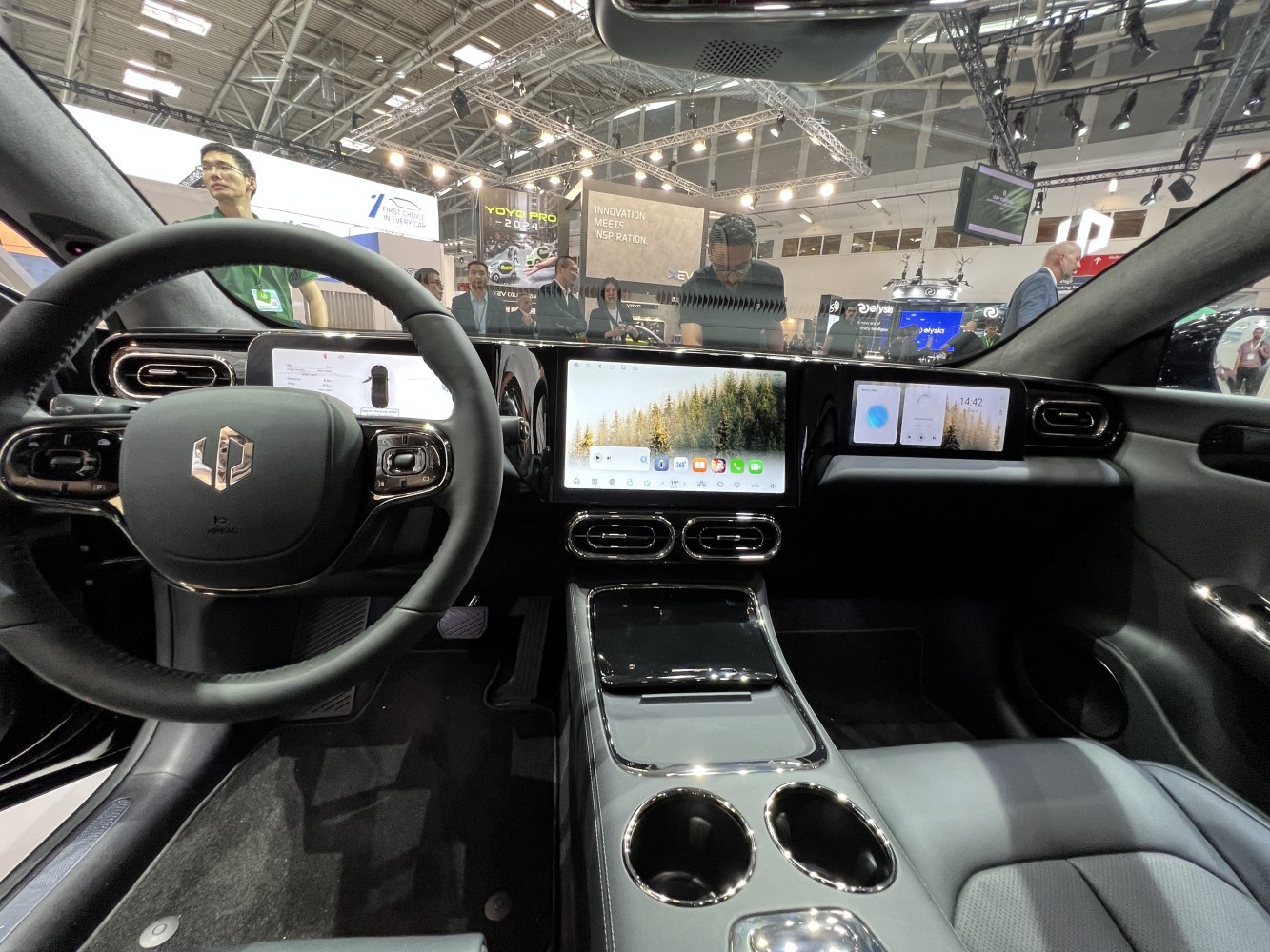 Dual digital instrument cluster and infotainment touchscreen setup in car interior