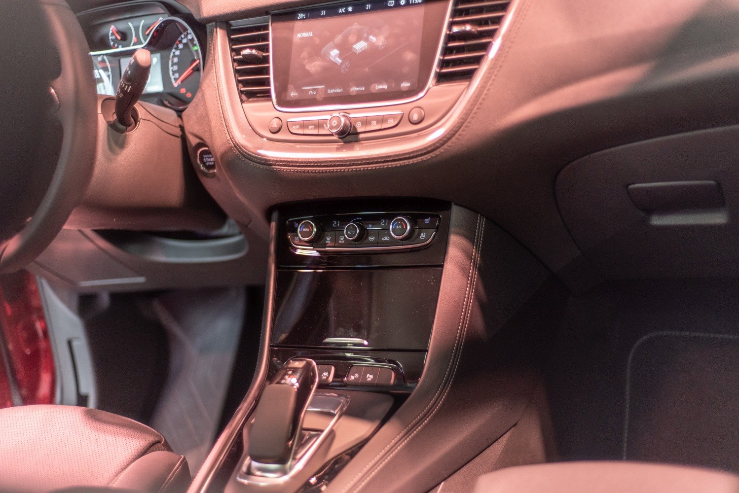 Infotainment display and center console with climate controls and gear shift