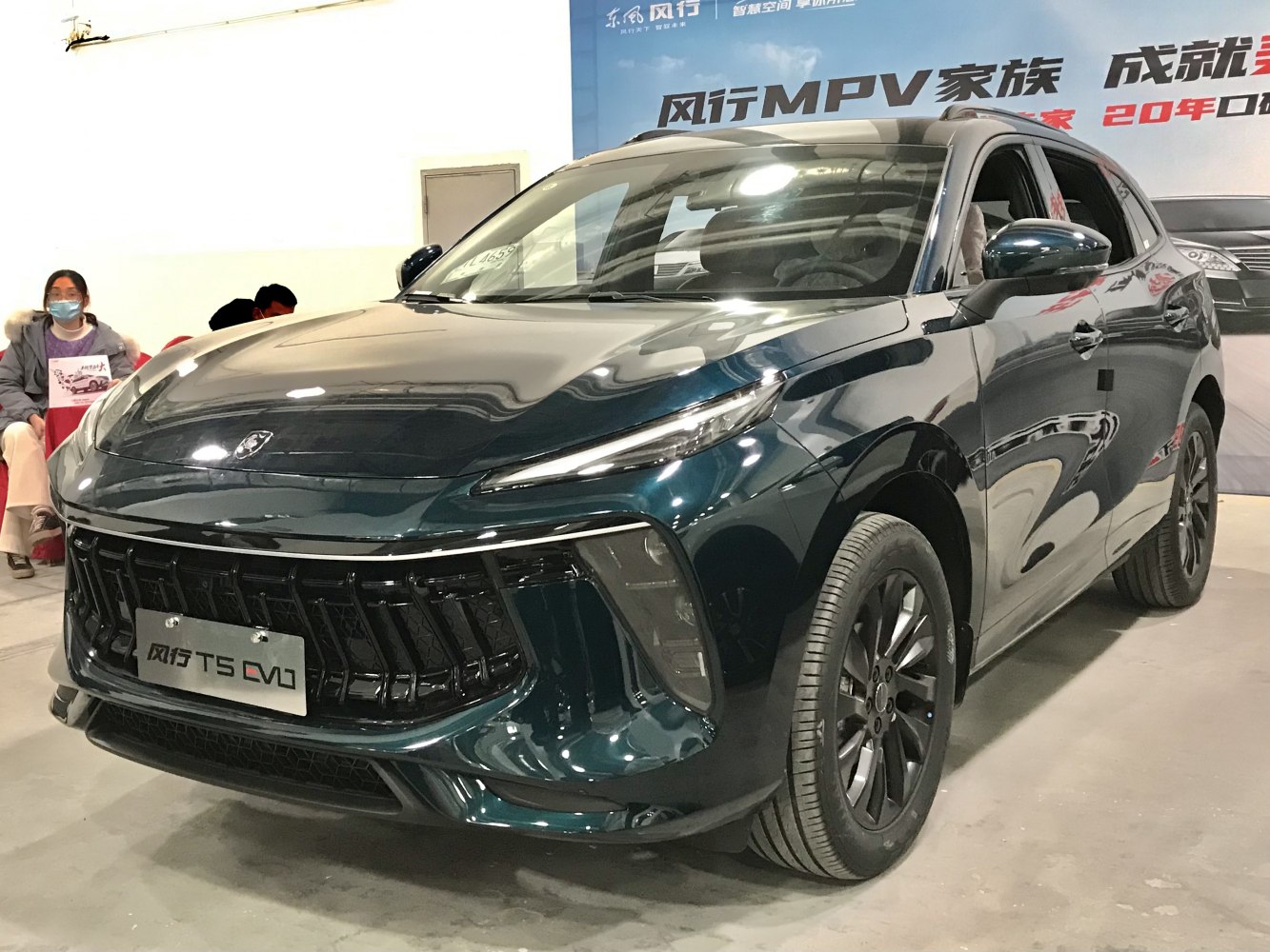 Close-up of front grille and sleek LED headlights.