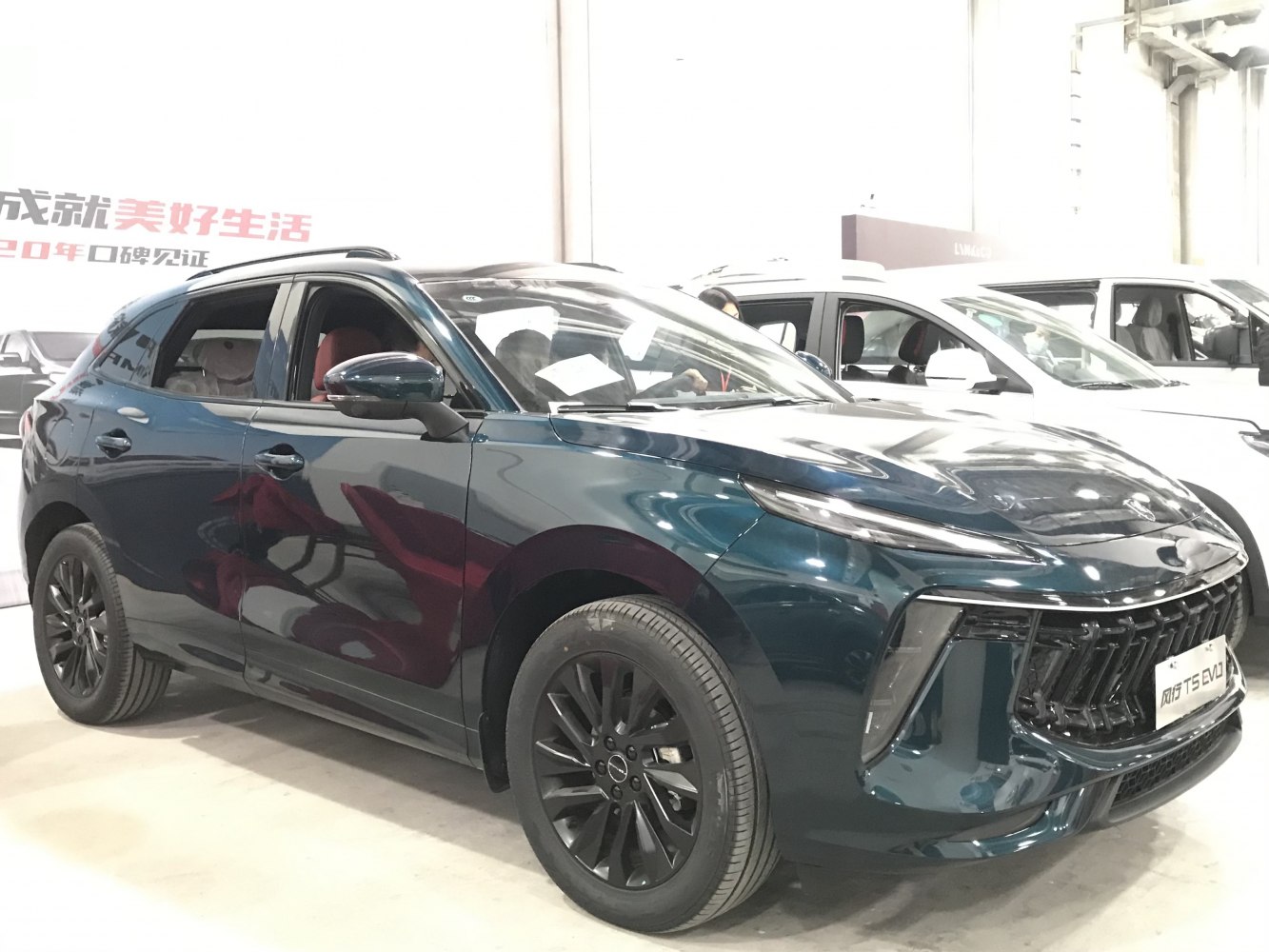Front side view with aggressive grille and black alloy wheels