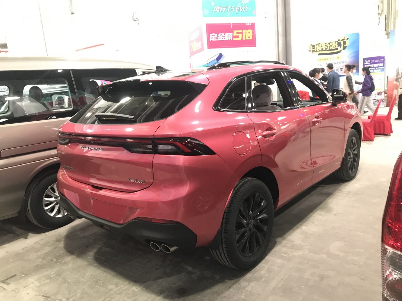 Rear view with dual exhaust and black alloy wheels