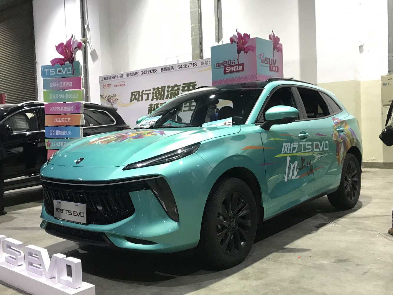 Sleek SUV front fascia with turquoise paint and vibrant side graphics