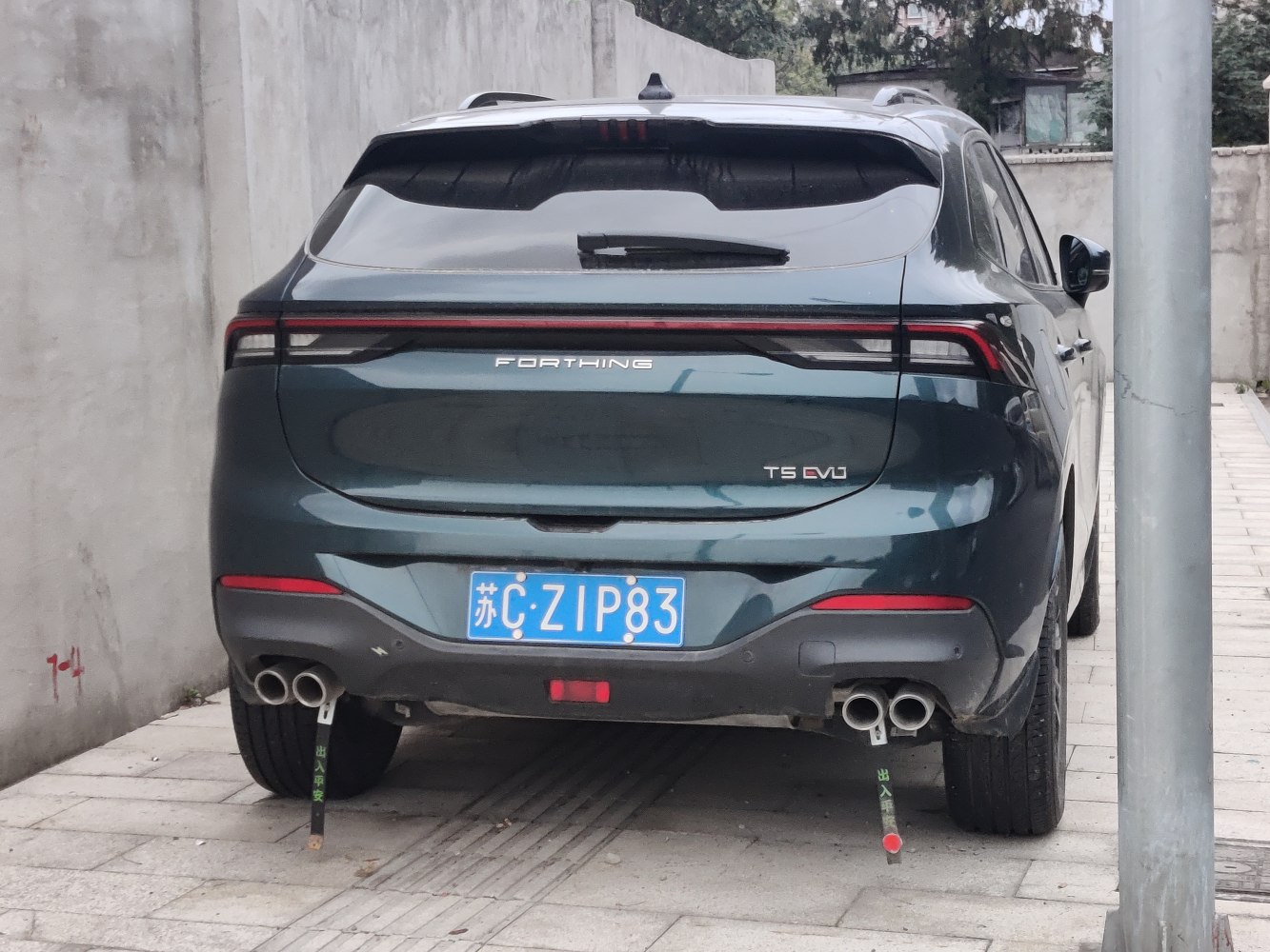 Rear view with LED tail light bar and dual exhaust pipes