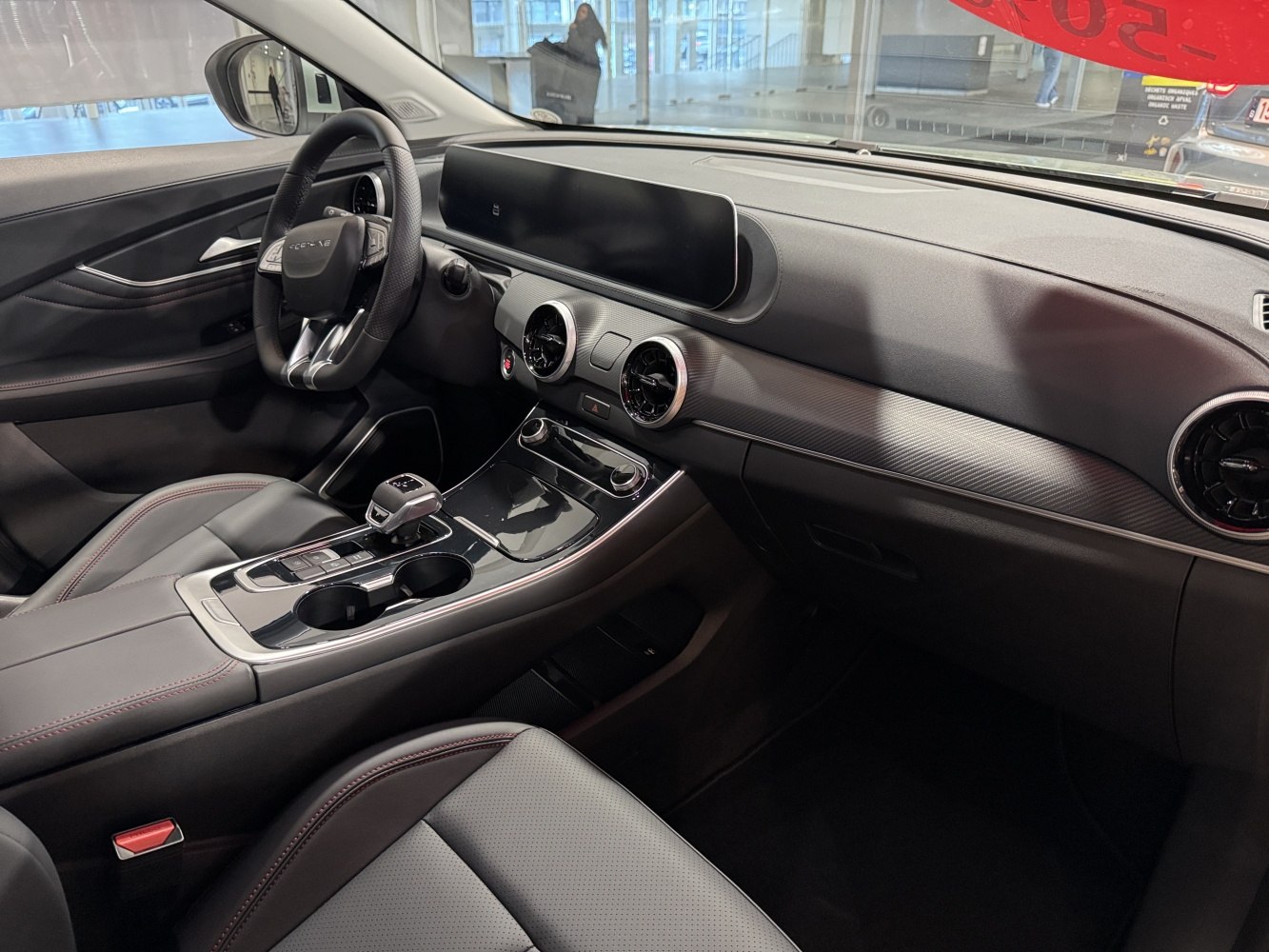 Digital instrument cluster and round air vents in car interior