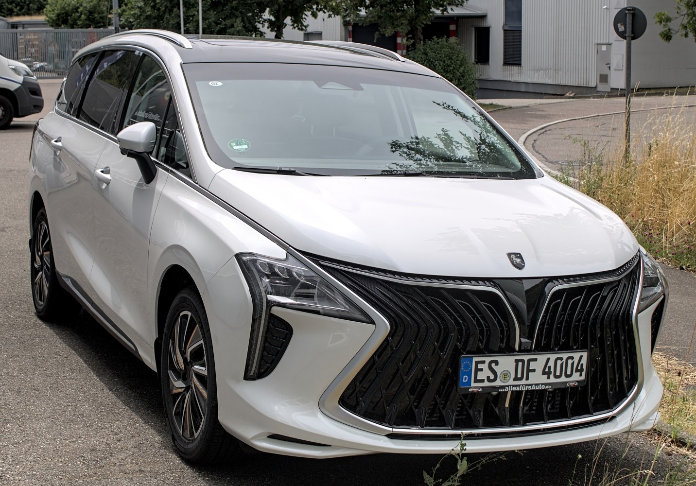 Front grille and LED headlights design of modern minivan