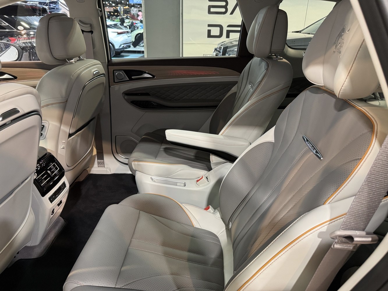 Luxury rear passenger seats with premium leather and wood trim