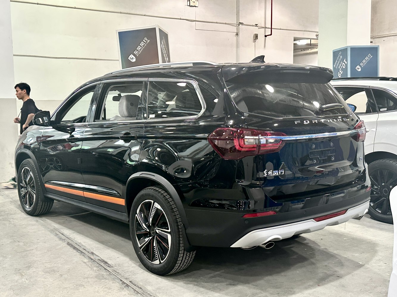Rear view and alloy wheels of a black modern SUV