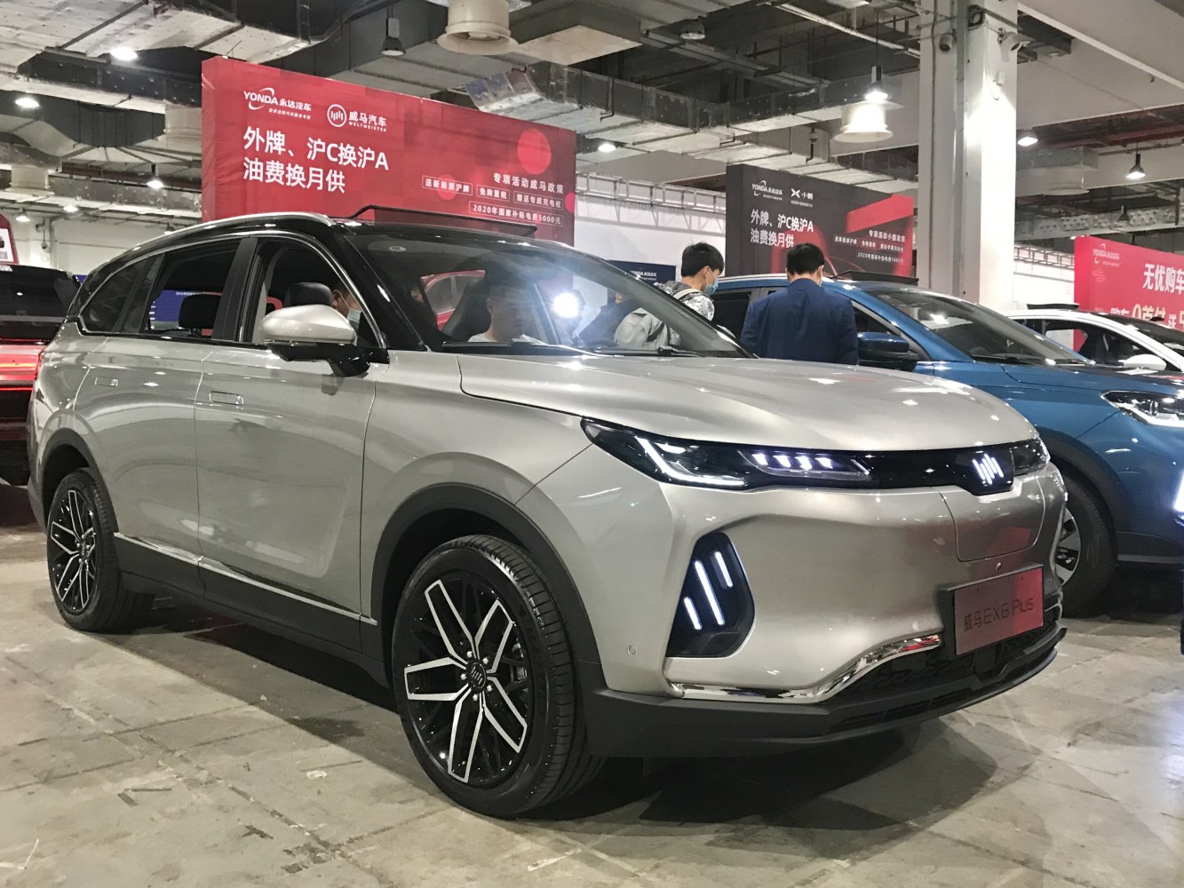 Front side view of modern SUV with sleek LED headlights and alloy wheels