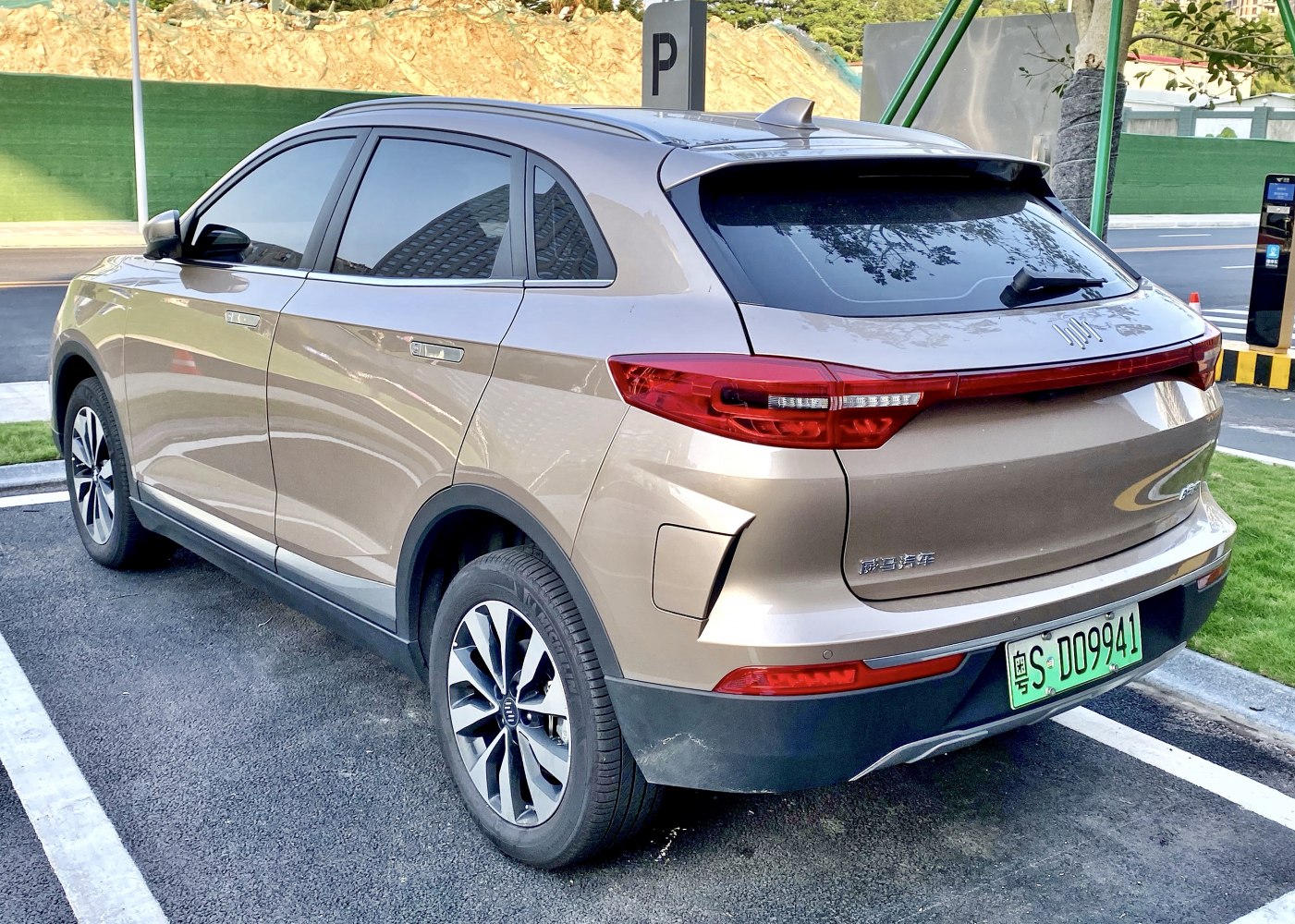 Rear and side view of an electric SUV with distinctive taillights and aerodynamic shape