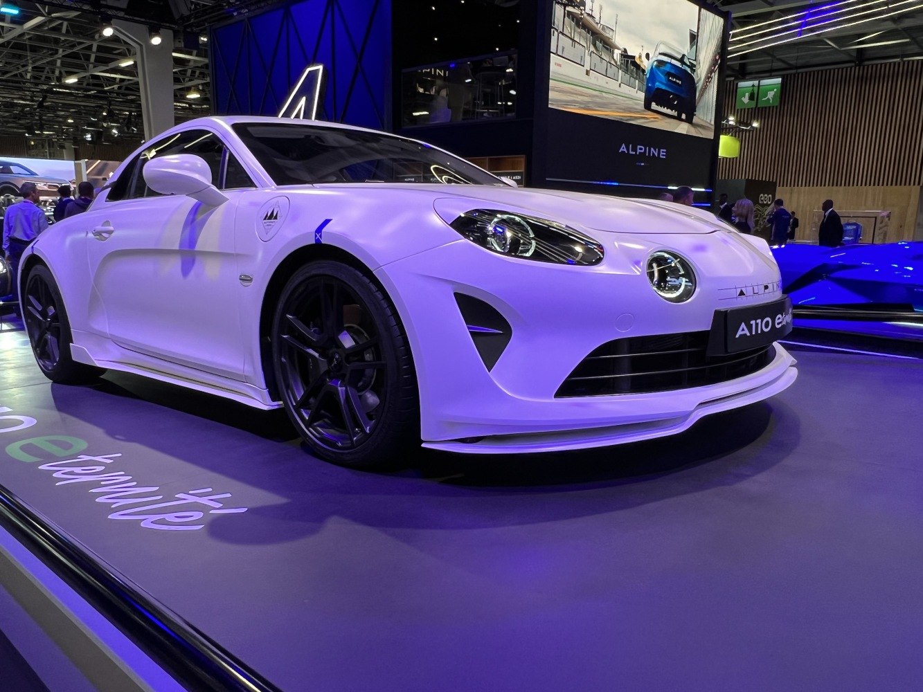 Front-side view of sports prototype with sleek headlights and black alloy wheels