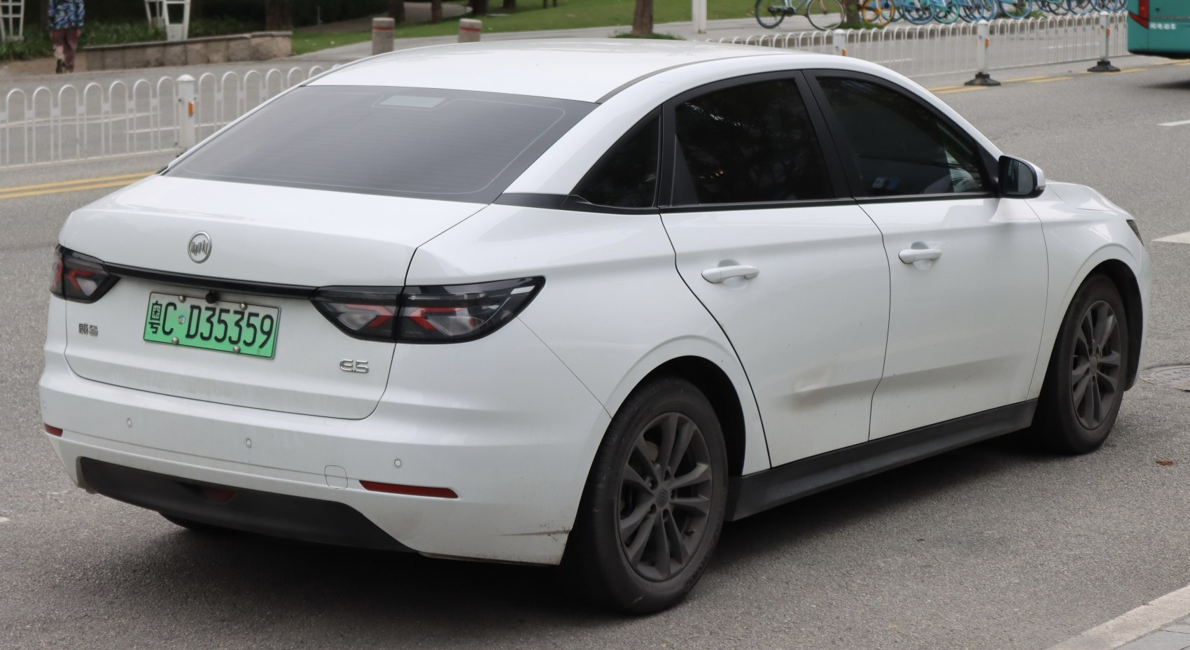 Rear view of an electric sedan with modern taillights and aerodynamic shape