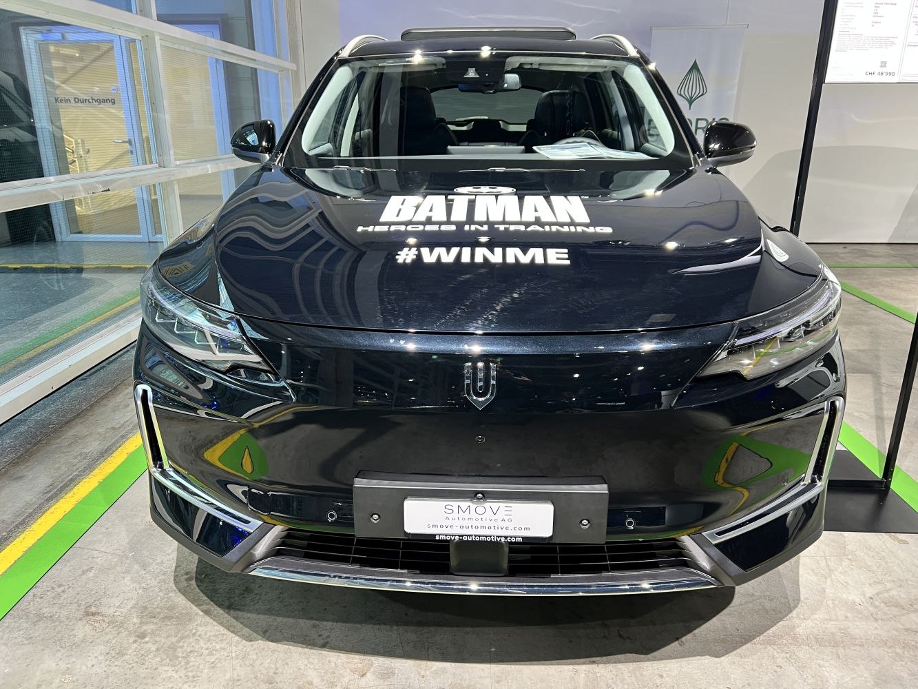 Modern electric SUV front with LED headlights and sleek grille