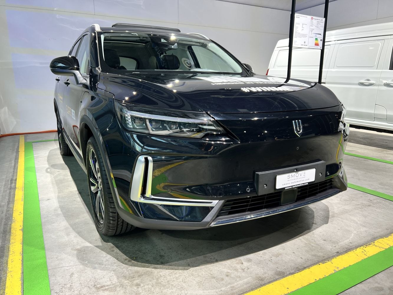 Electric SUV front view with LED headlights and modern grille design