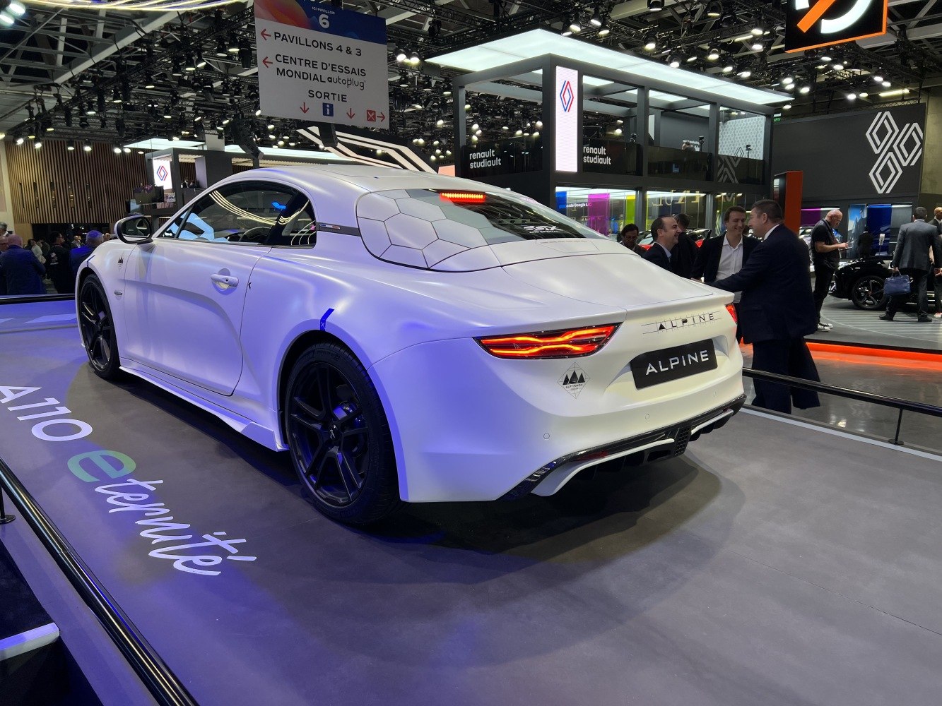 Rear view of sports coupe with hexagonal roof pattern and distinct taillights