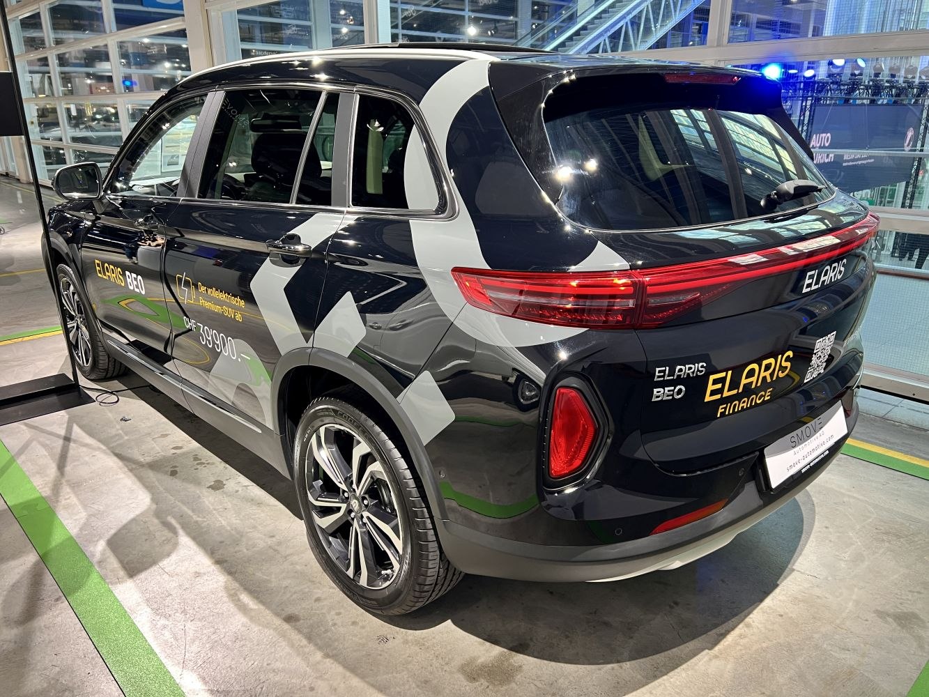 Rear and side view of a premium electric SUV with LED taillights and alloy wheels