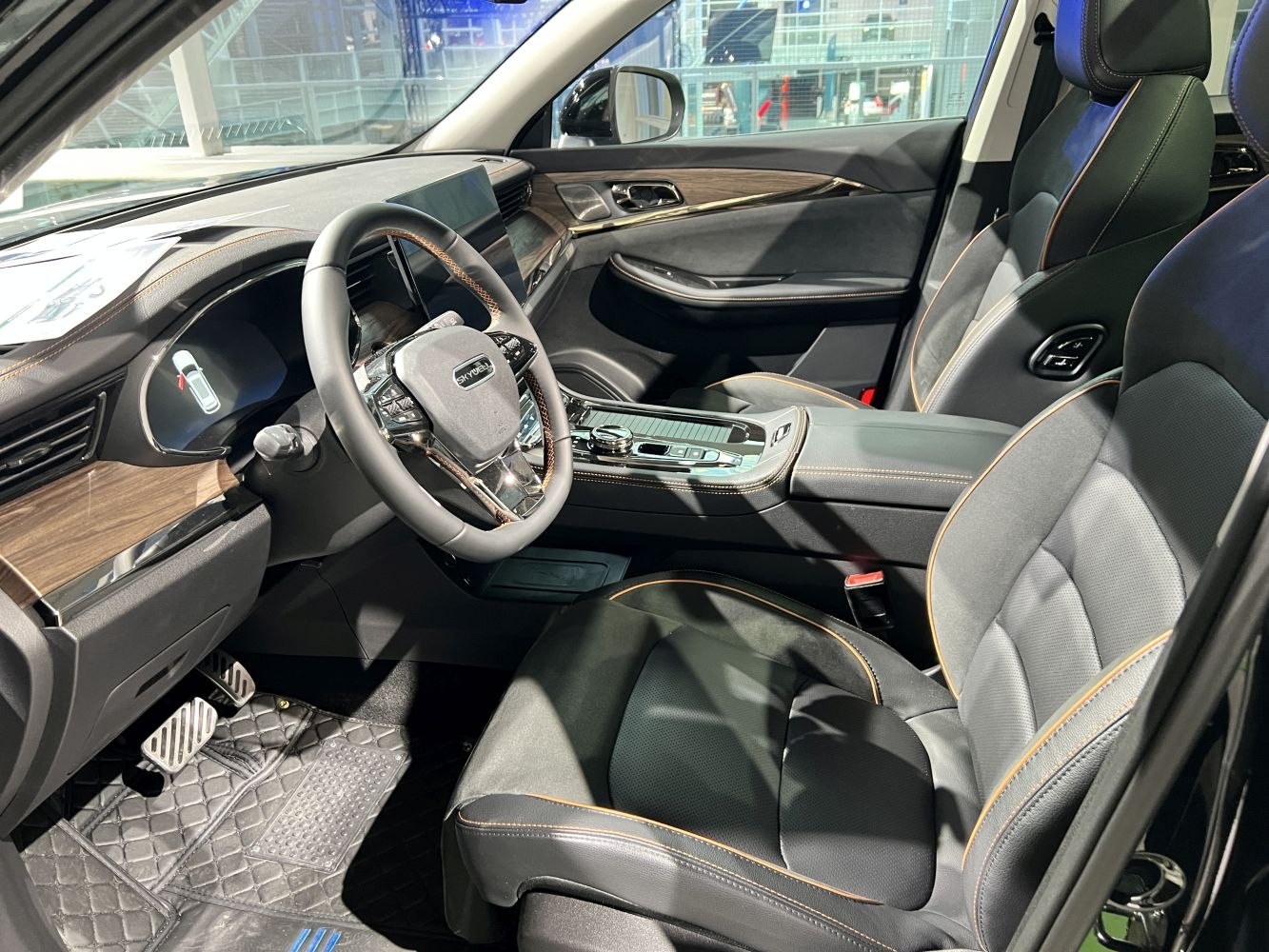 Modern car interior with digital dashboard and leather seats