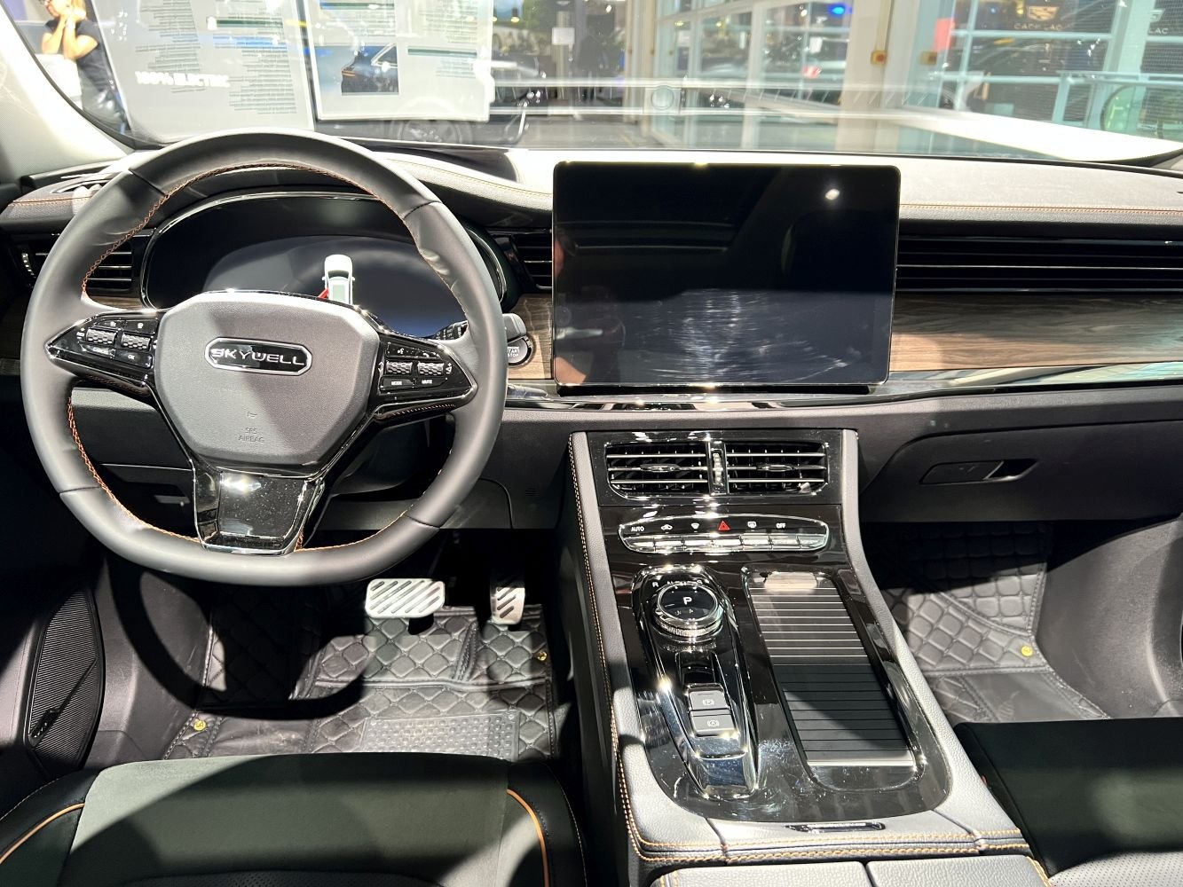 Steering wheel with controls, digital instrument panel, large touchscreen center display