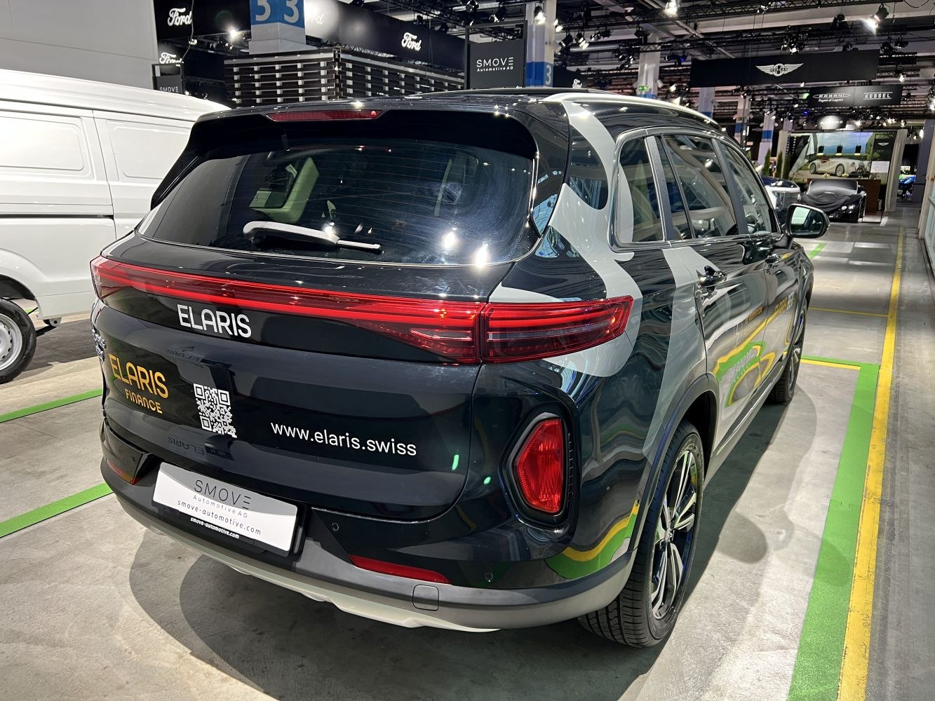 Rear view of electric SUV with sleek taillights and rear wiper