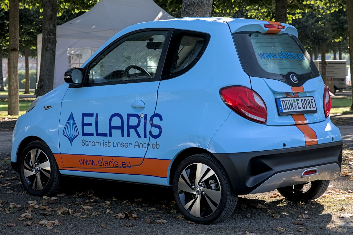 Compact electric city vehicle with distinctive taillights and alloy wheels