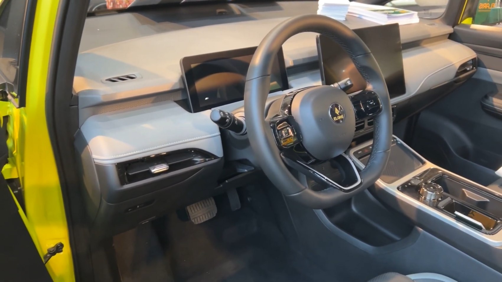 Modern car interior with dual digital displays and advanced steering wheel controls
