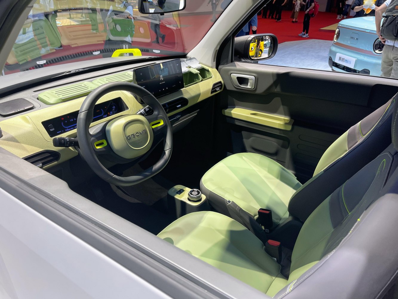 Compact electric car interior with digital dashboard and touchscreen display
