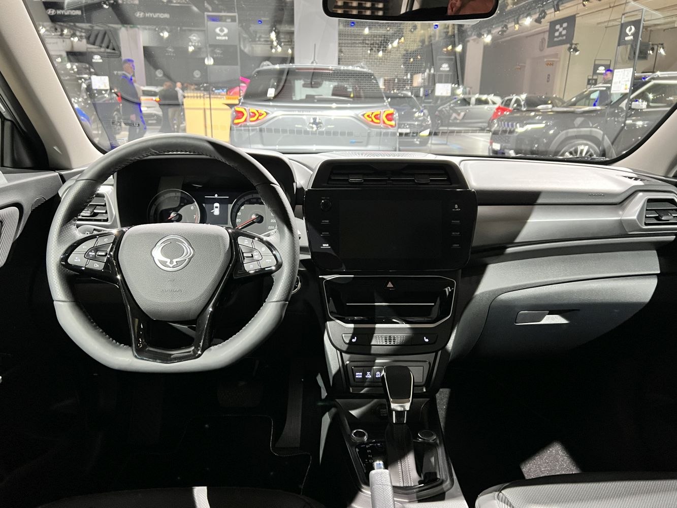 Steering wheel and center console with digital controls and gear shift