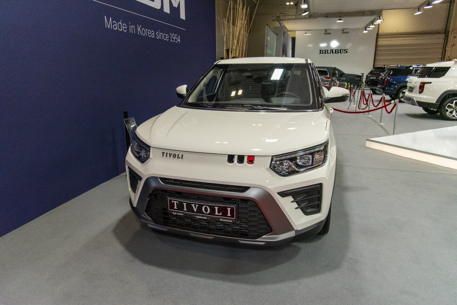 Front view with modern headlights and wide grille