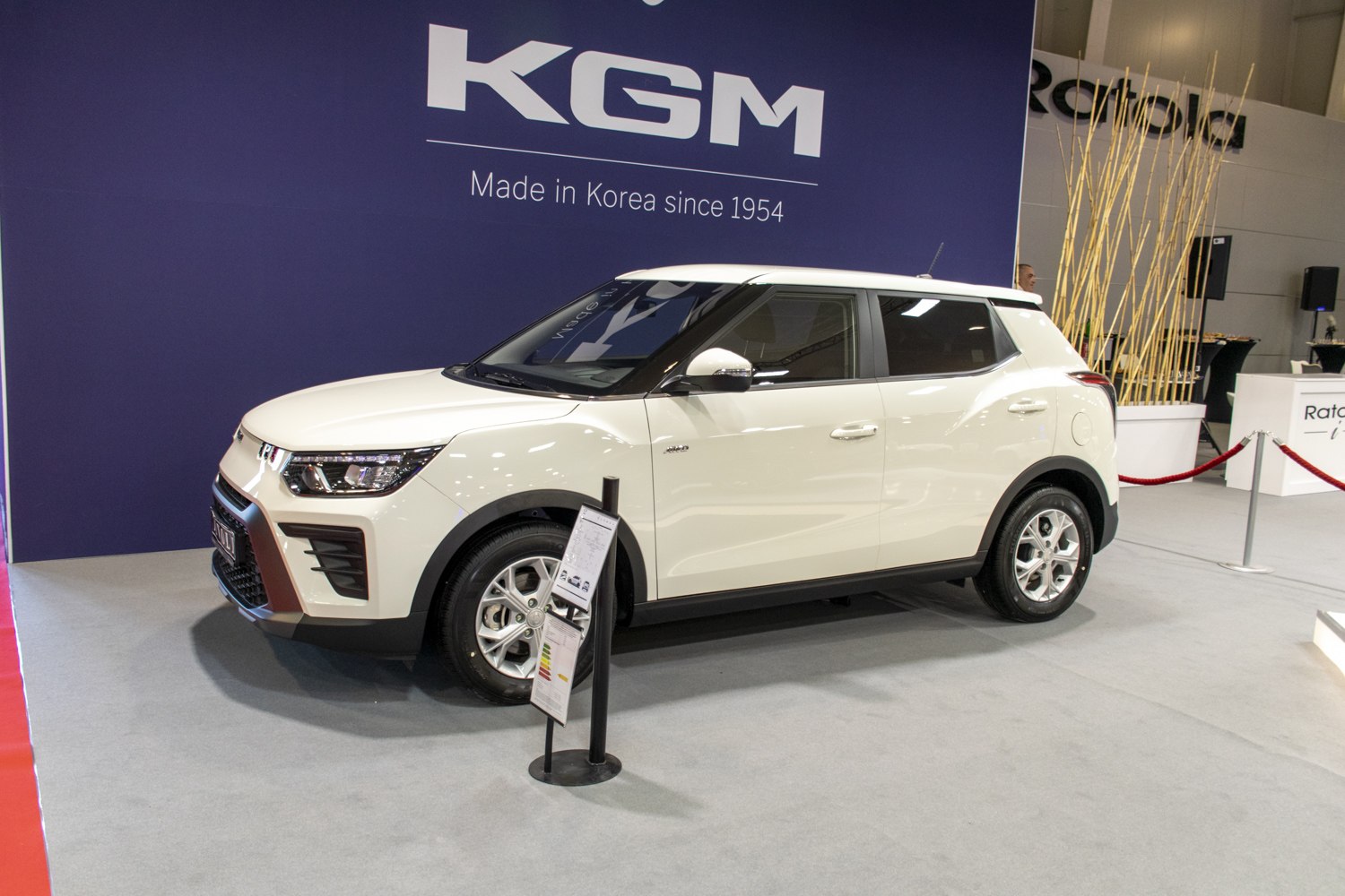 Front-side view of white compact SUV with alloy wheels and modern headlights