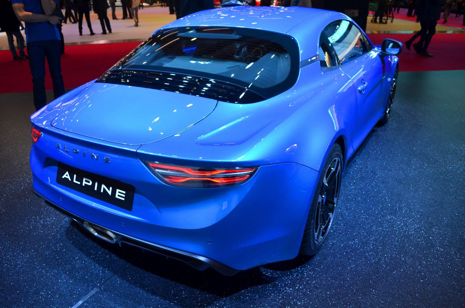 Sleek taillights and aerodynamic rear profile of a sports coupe