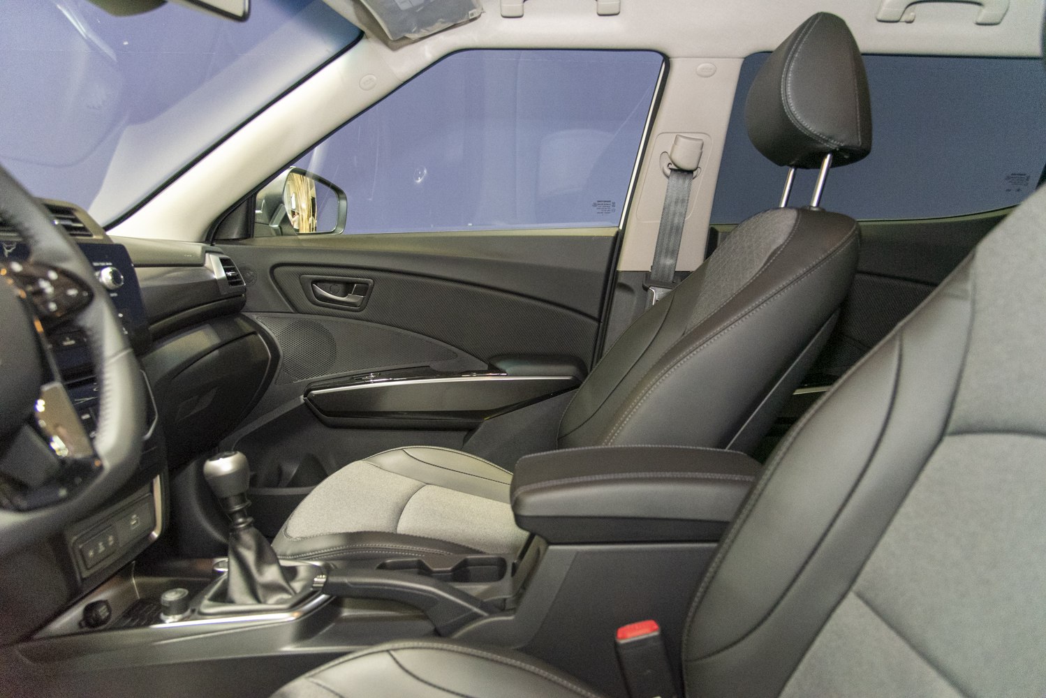 Leather seats with manual transmission gear stick in car interior