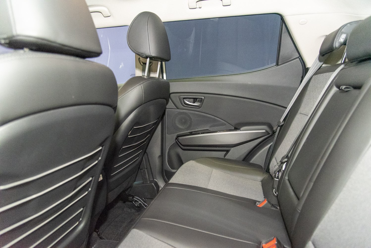 Rear seat interior with upholstery and ergonomic door panel